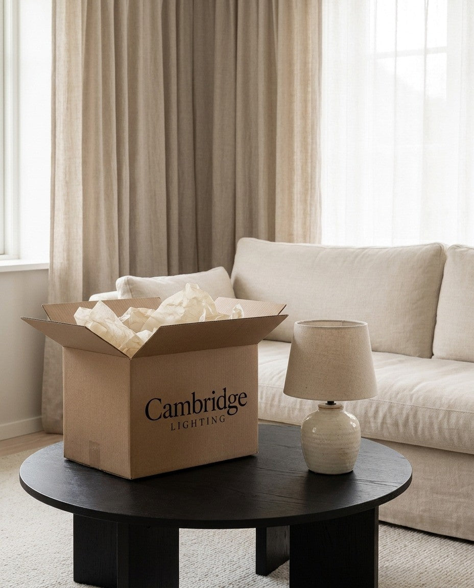 Cambridge Lighting table lamp unboxed on a coffee table